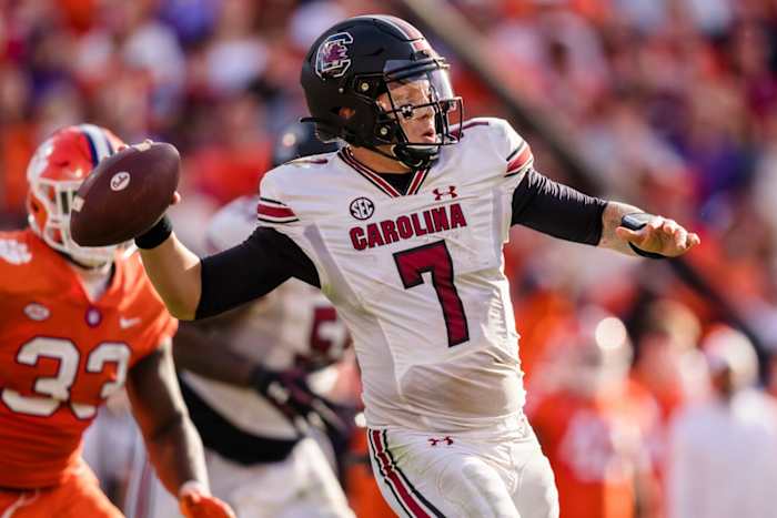 South Carolina quarterback Spencer Rattler delivers a pass downfield against Clemson at Memorial Stadium in Clemson, S.C.